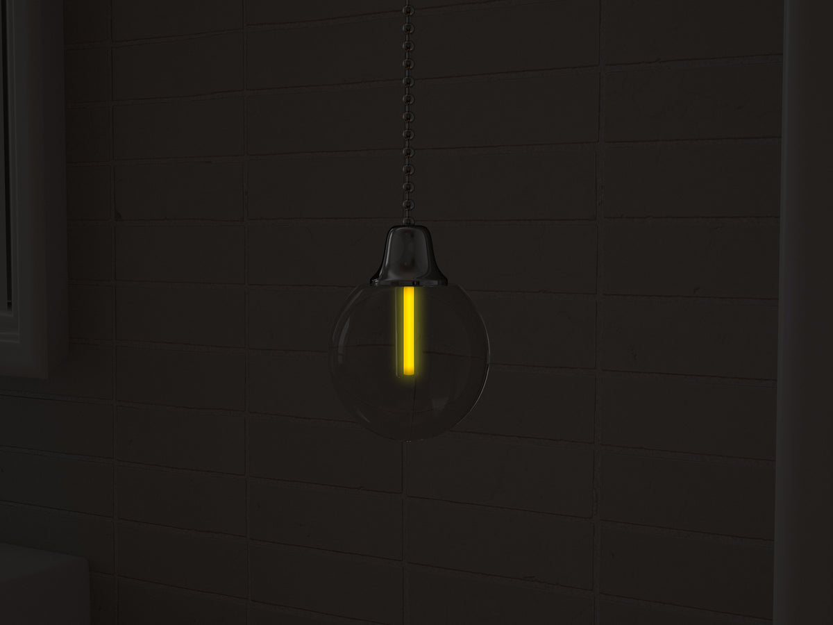 Vega tritium light pull with yellow glowing vial in the dark
