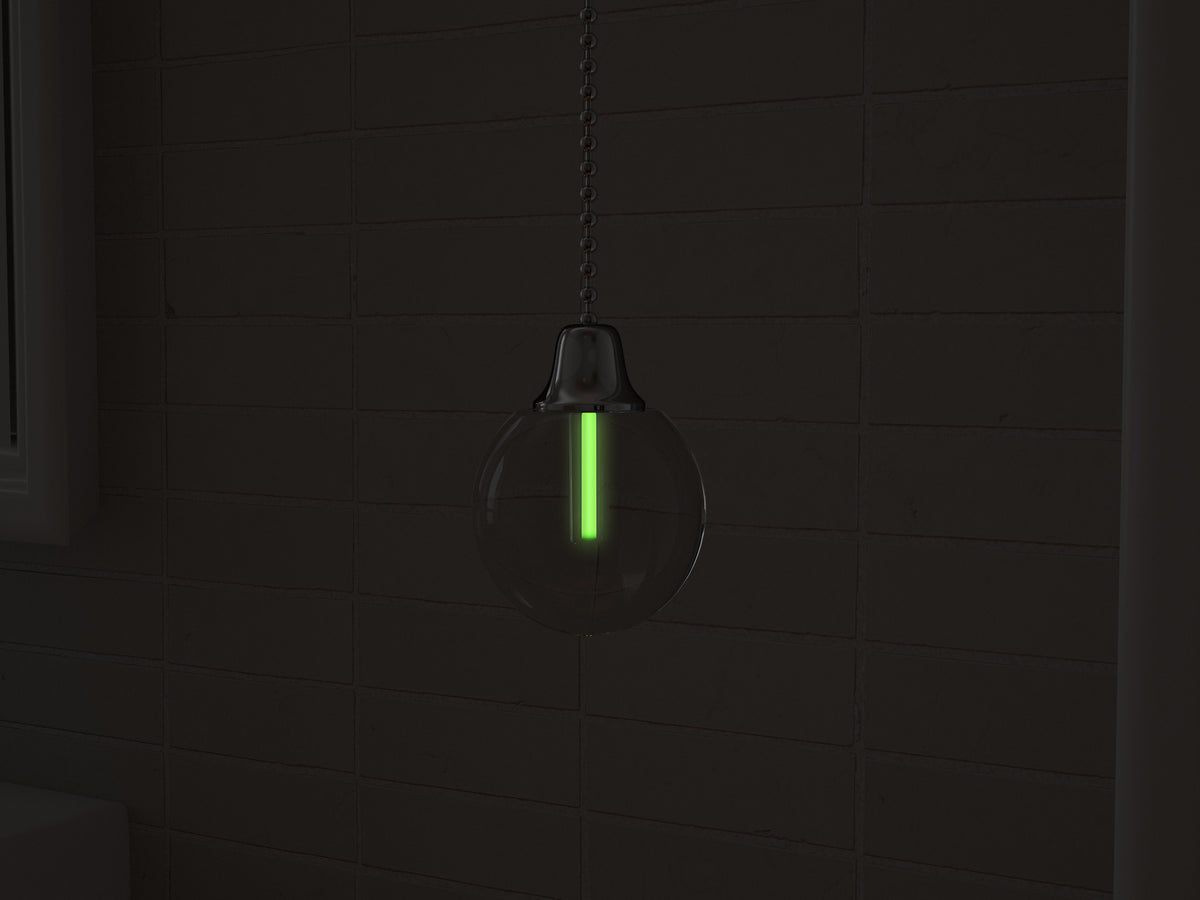 Vega tritium light pull with green glowing vial in the dark