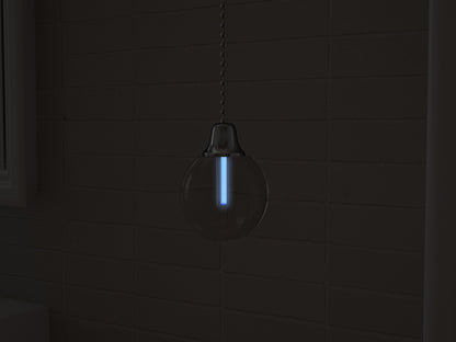 Vega tritium light pull with ice-blue glowing vial in the dark