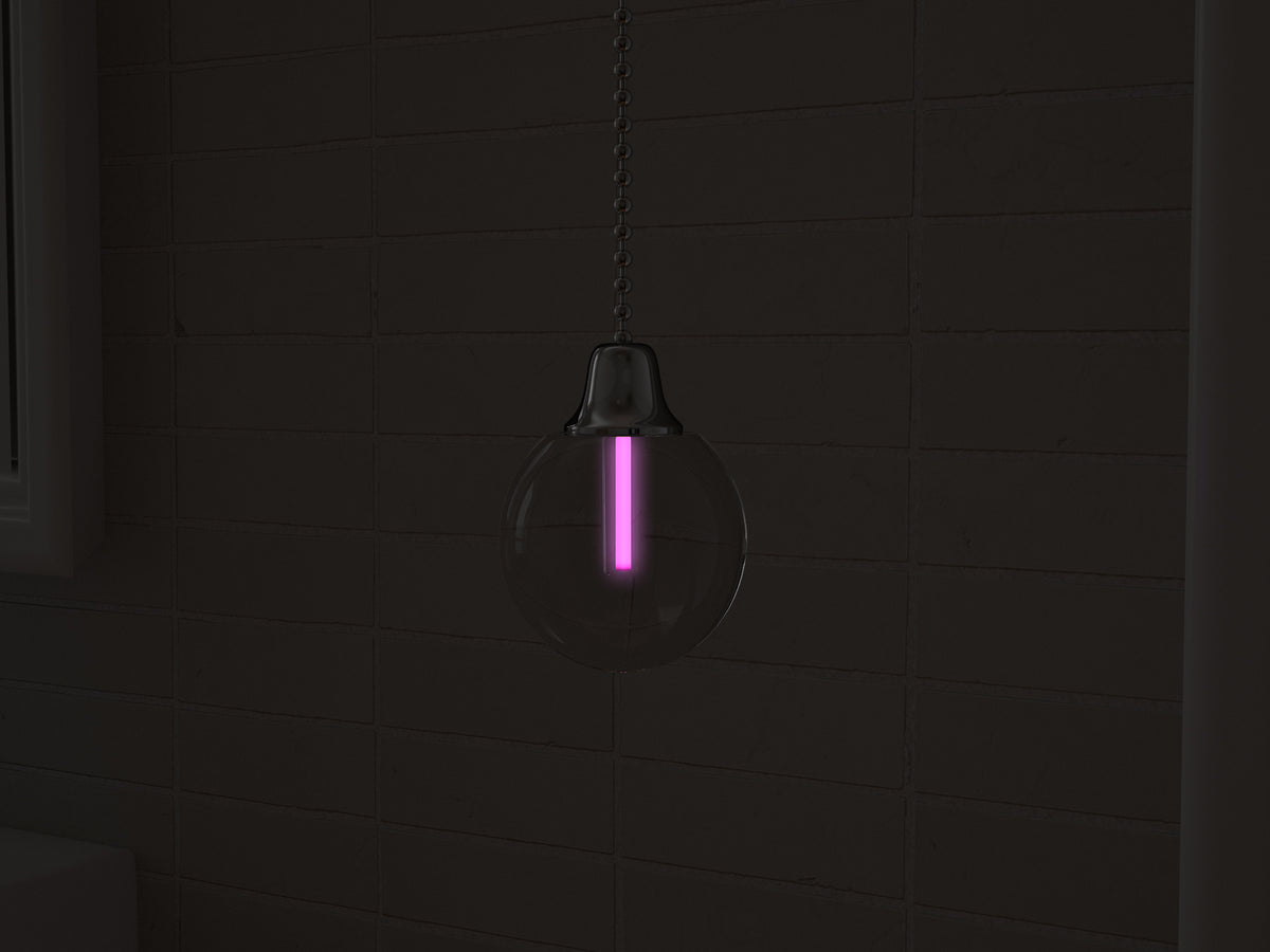 Vega tritium light pull with pink glowing vial in the dark