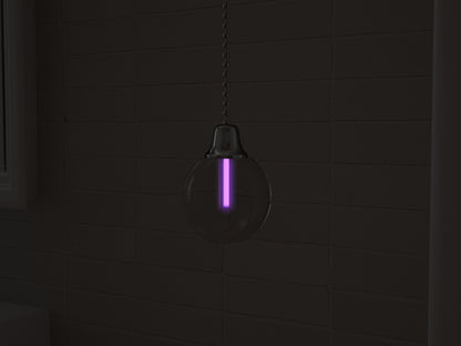 Vega tritium light pull with purple glowing vial in the dark