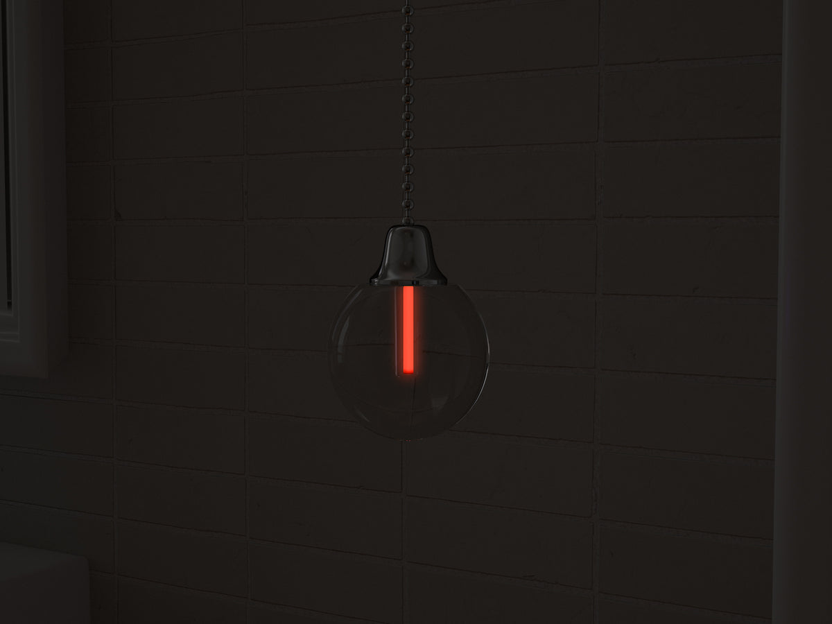 Vega tritium light pull with red glowing vial in the dark