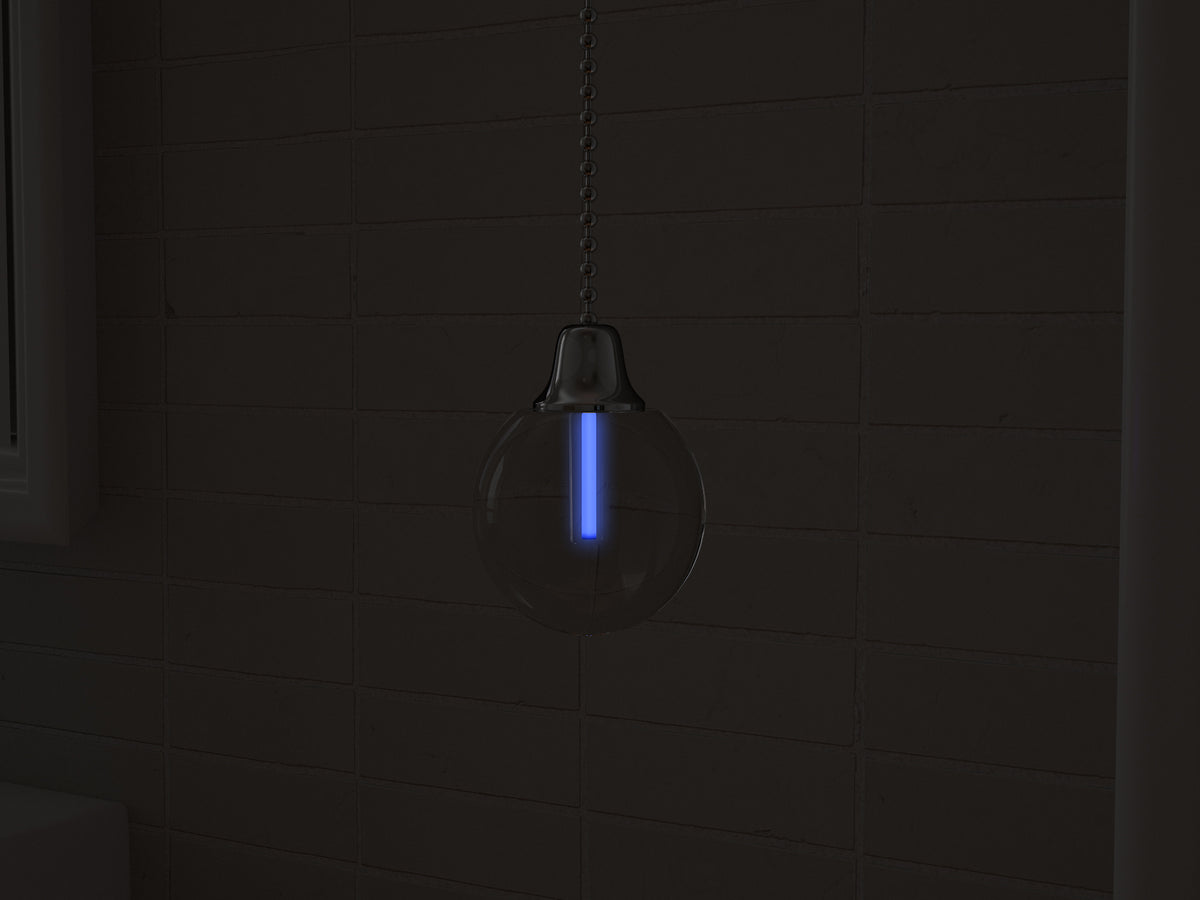 Vega tritium light pull with UV-blue glowing vial in the dark