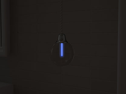Vega tritium light pull with UV-blue glowing vial in the dark